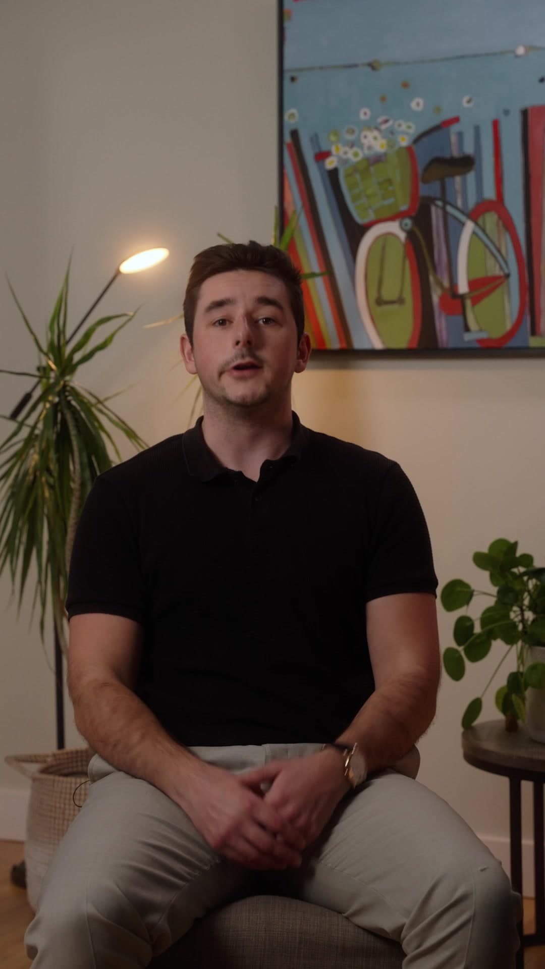 Marc Black, founder of Peak Studios CO, seated in a living room